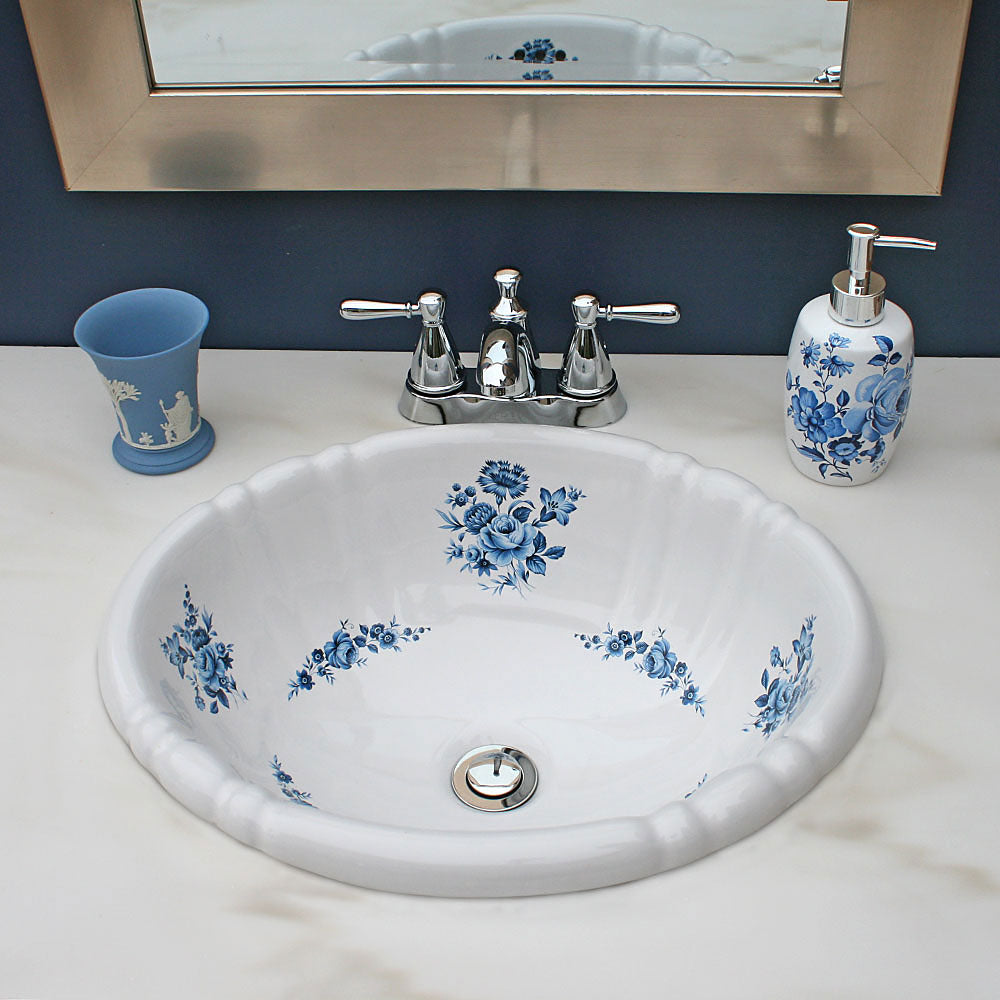 Blue powder room with blue roses painted sink and Wedgewood accents