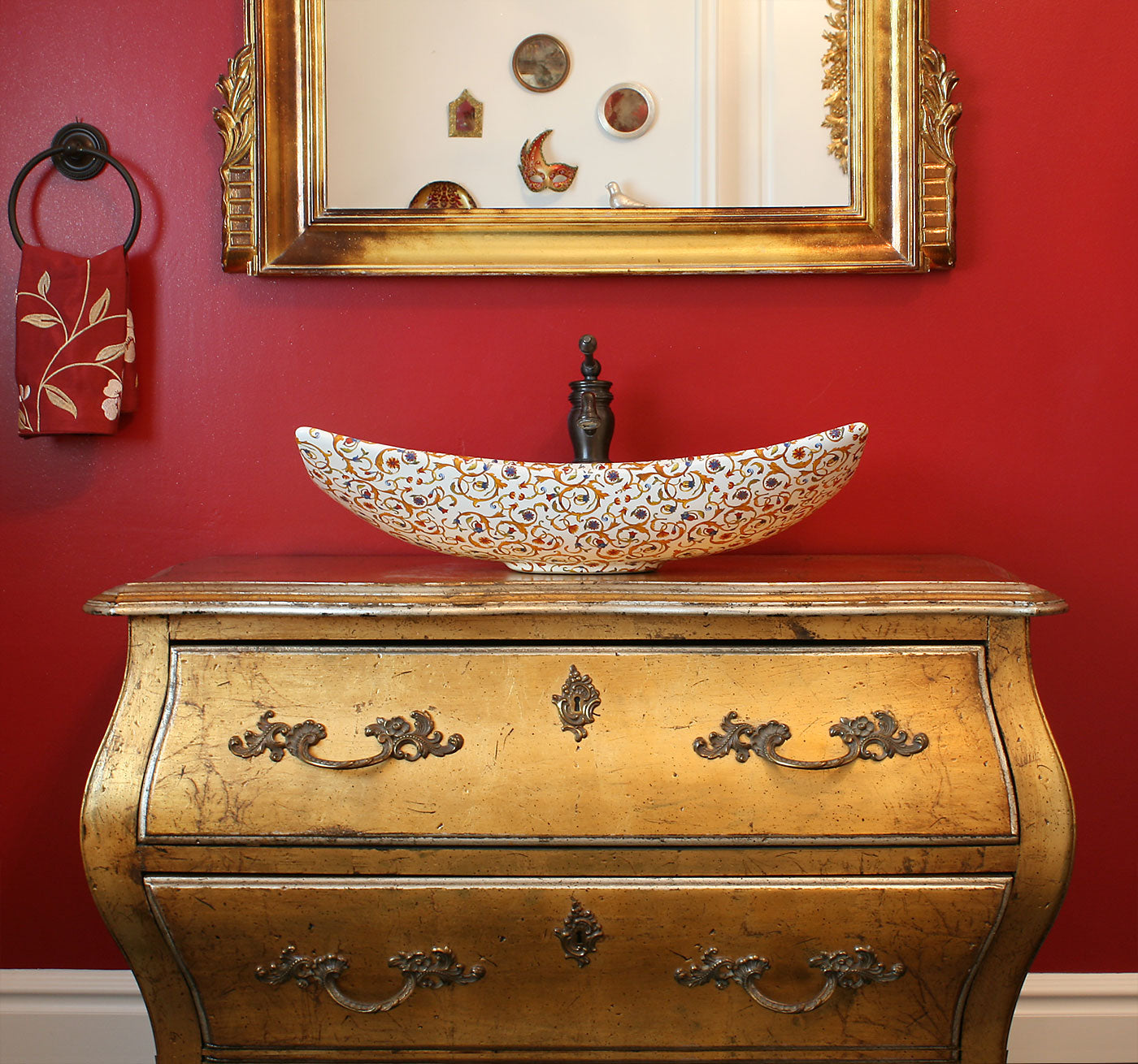 designer red bathroom with Florentine painted sink inrepurposed gold dresser vanity