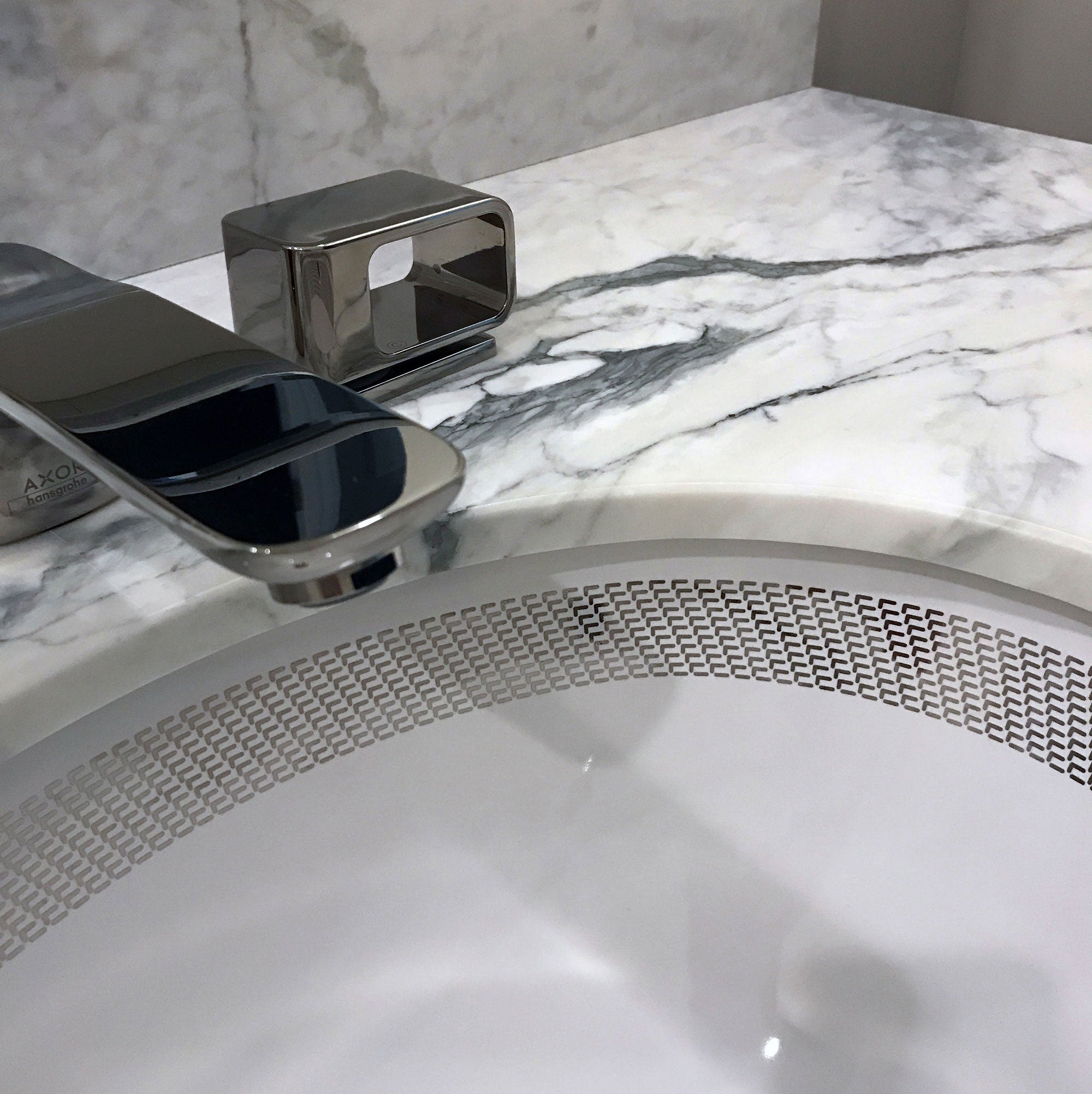 platinum border painted sink in vanity with white marble counter. Bathroom Design Idea.
