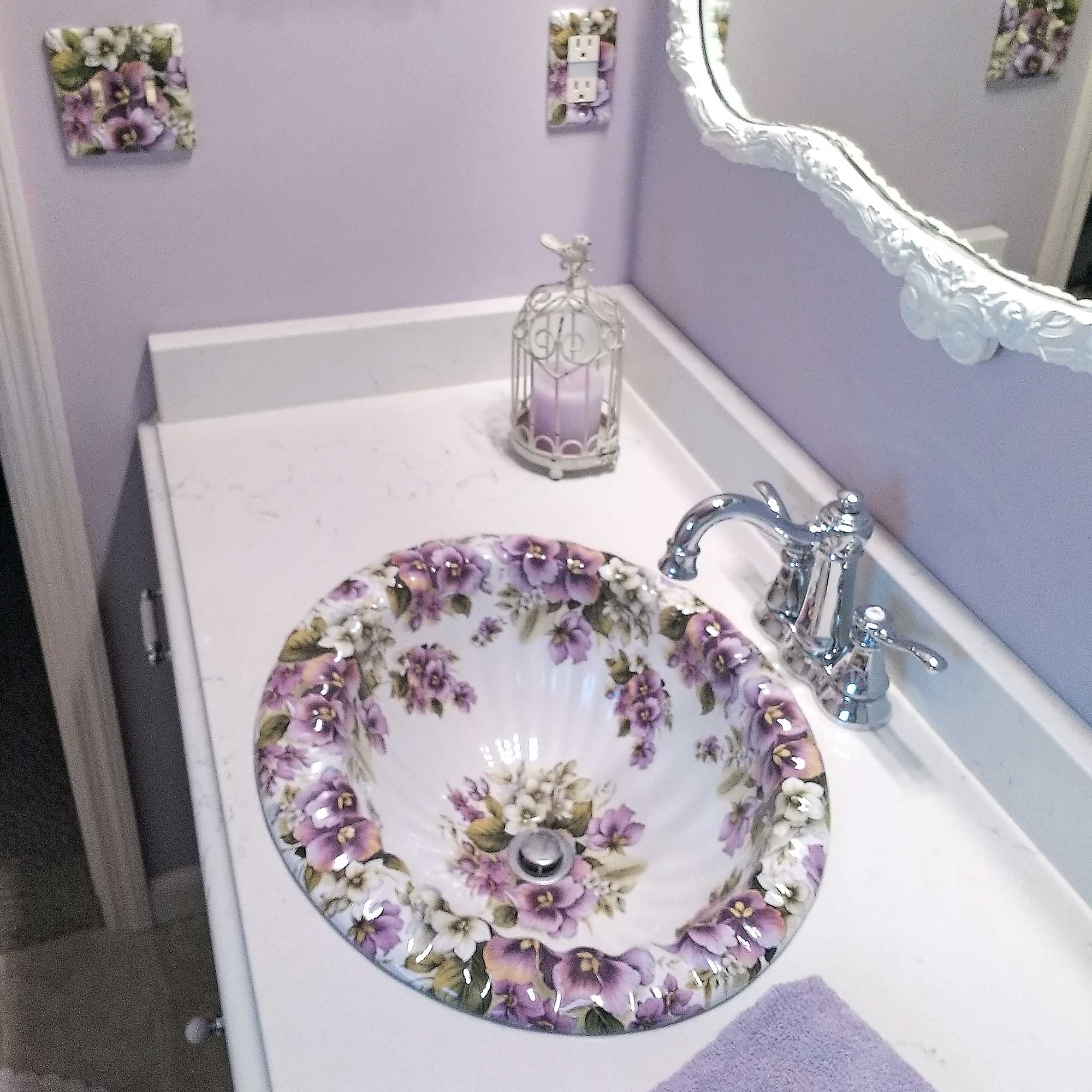 purple pansy painted scalloped sink in lavender bathroom