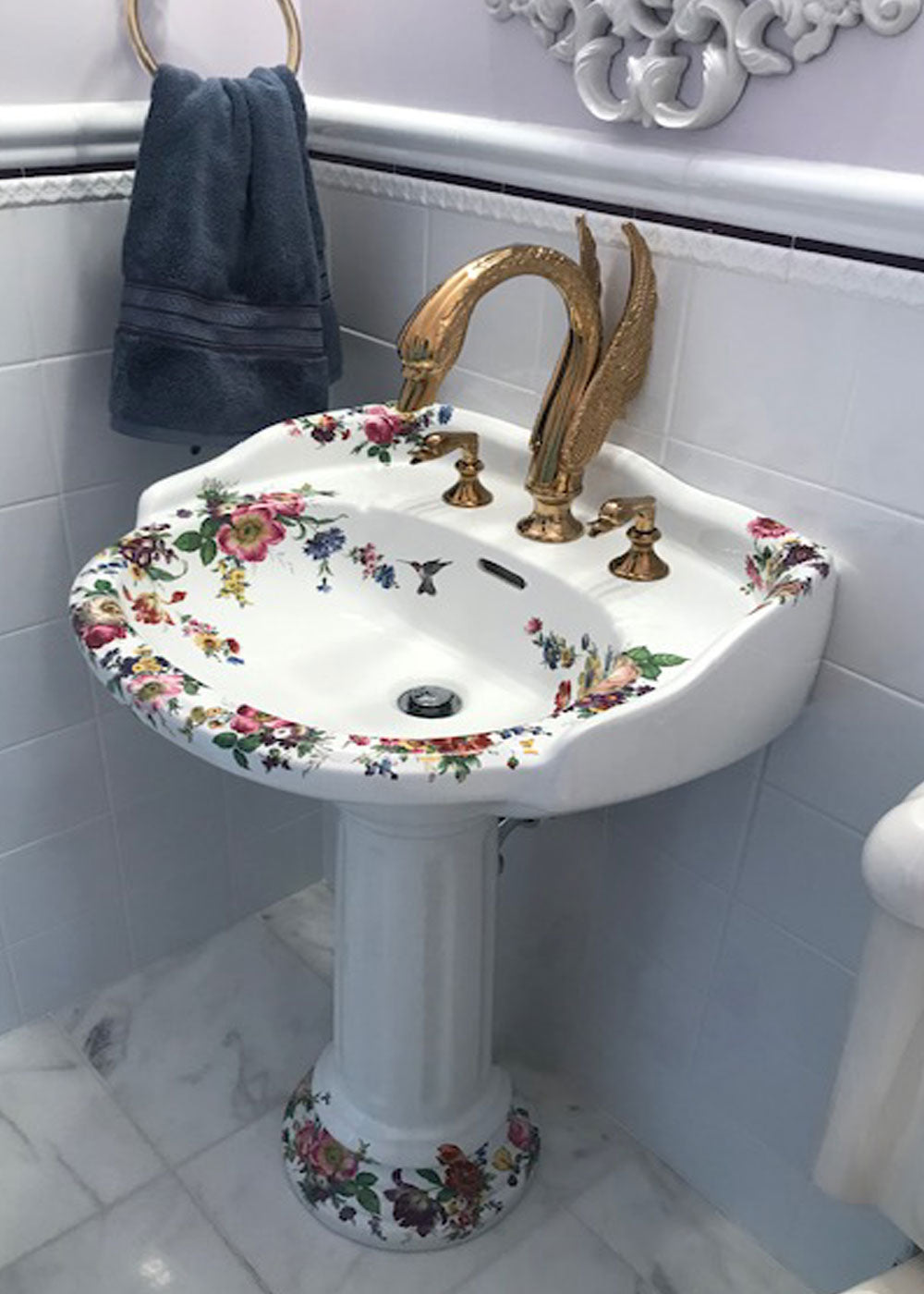 Powder Room Pedestal sink painted with flowers and swan faucets