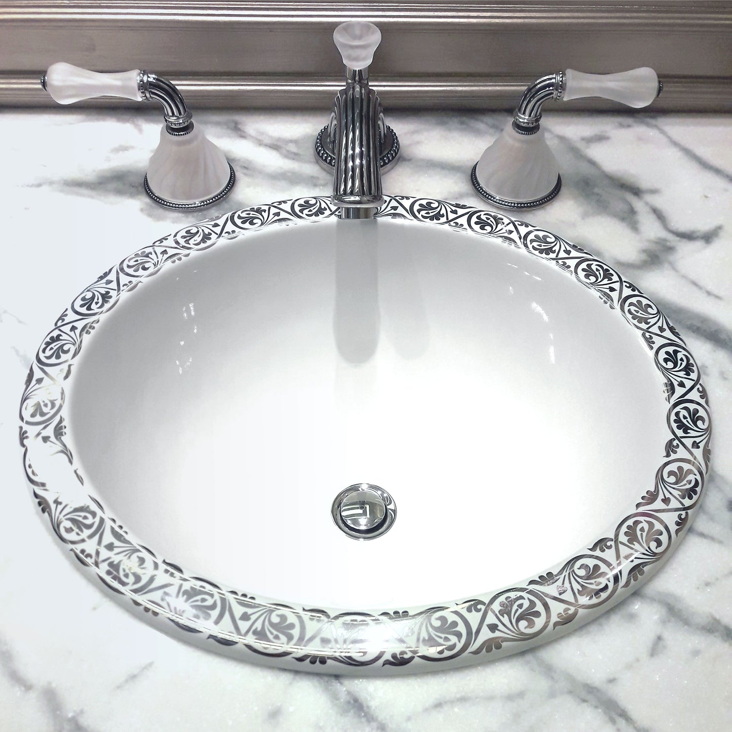 modern bathroom with marble counter and silver border painted sink