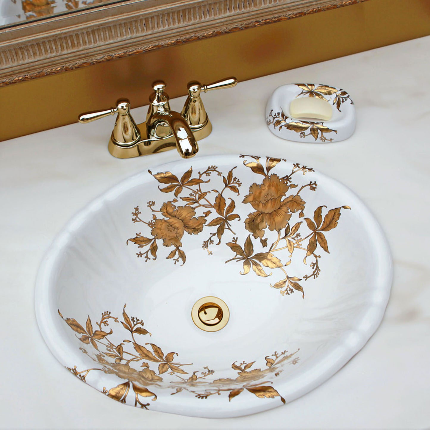 gold bathroom with gold orchids painted sink