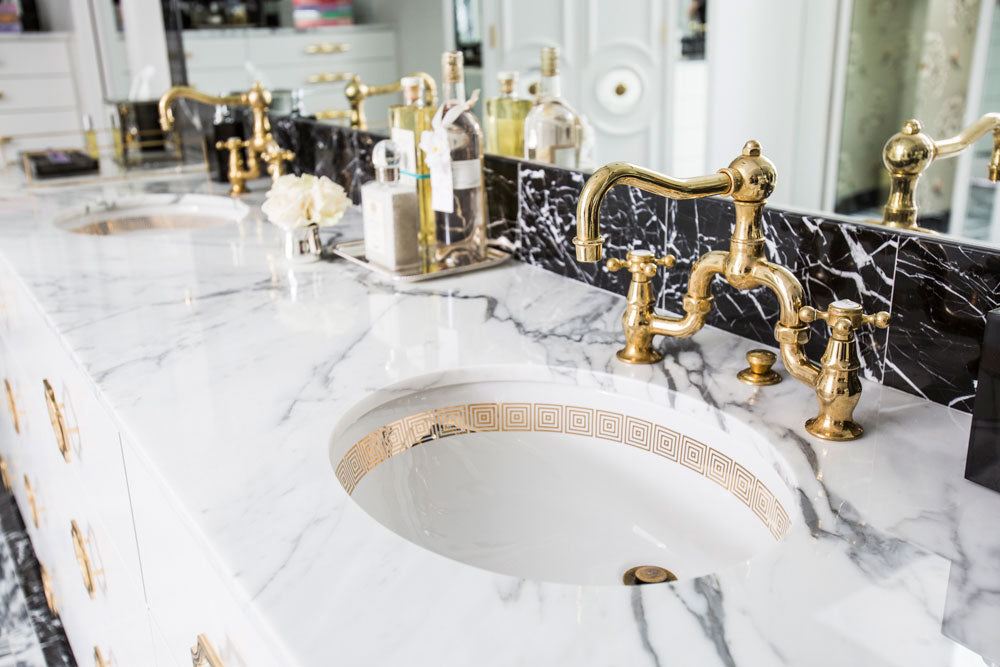 modern black white and gold bathroom. credit Julie Suffer Photography.