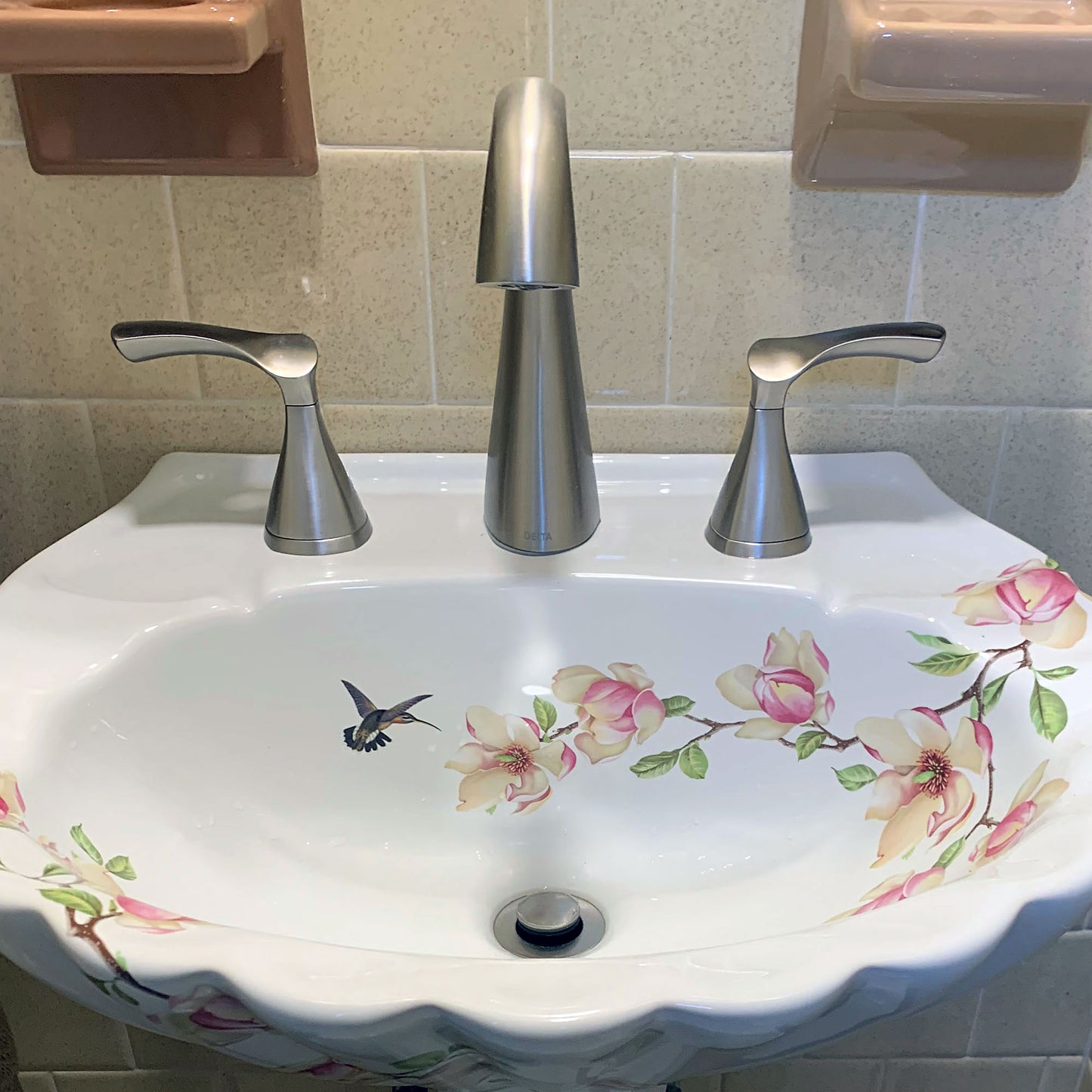 Bathroom with Pedestal sink painted with Magnolia blossoms and hummingbird.