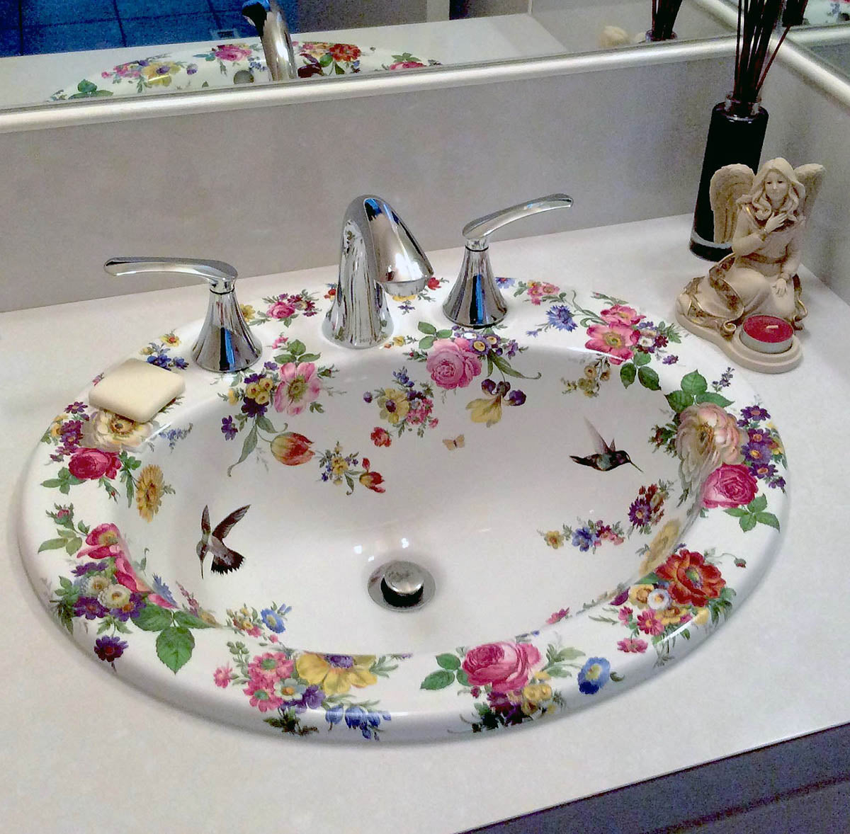 Powder room with painted bathroom sink of flowers, butterflies and hummingbirds