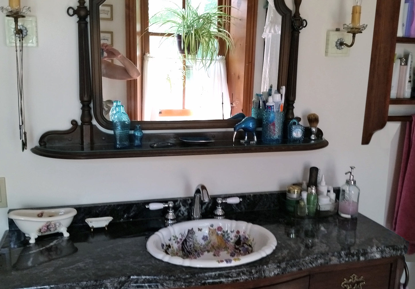 family bathroom with cats in the garden painted fluted bathroom sink.