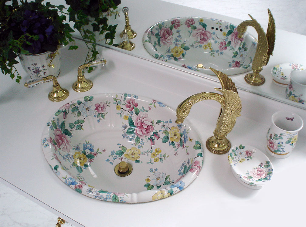 Fancy bathroom sink painted with flowers with swan faucet