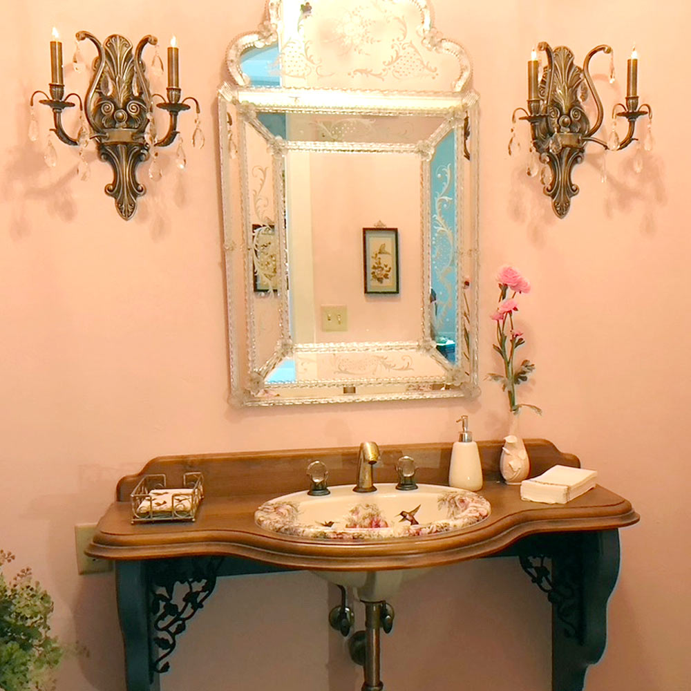 pink bathroom with Venetian mirror and Rococo painted sink