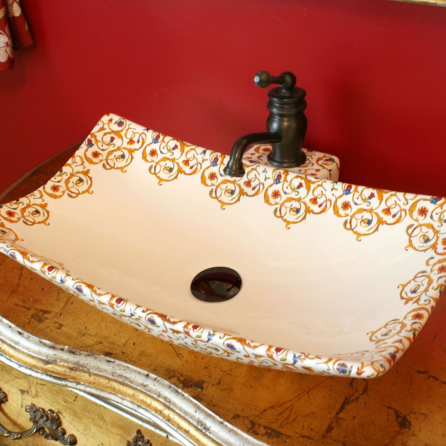 Red and gold powder room with Florentine modern vessel sink