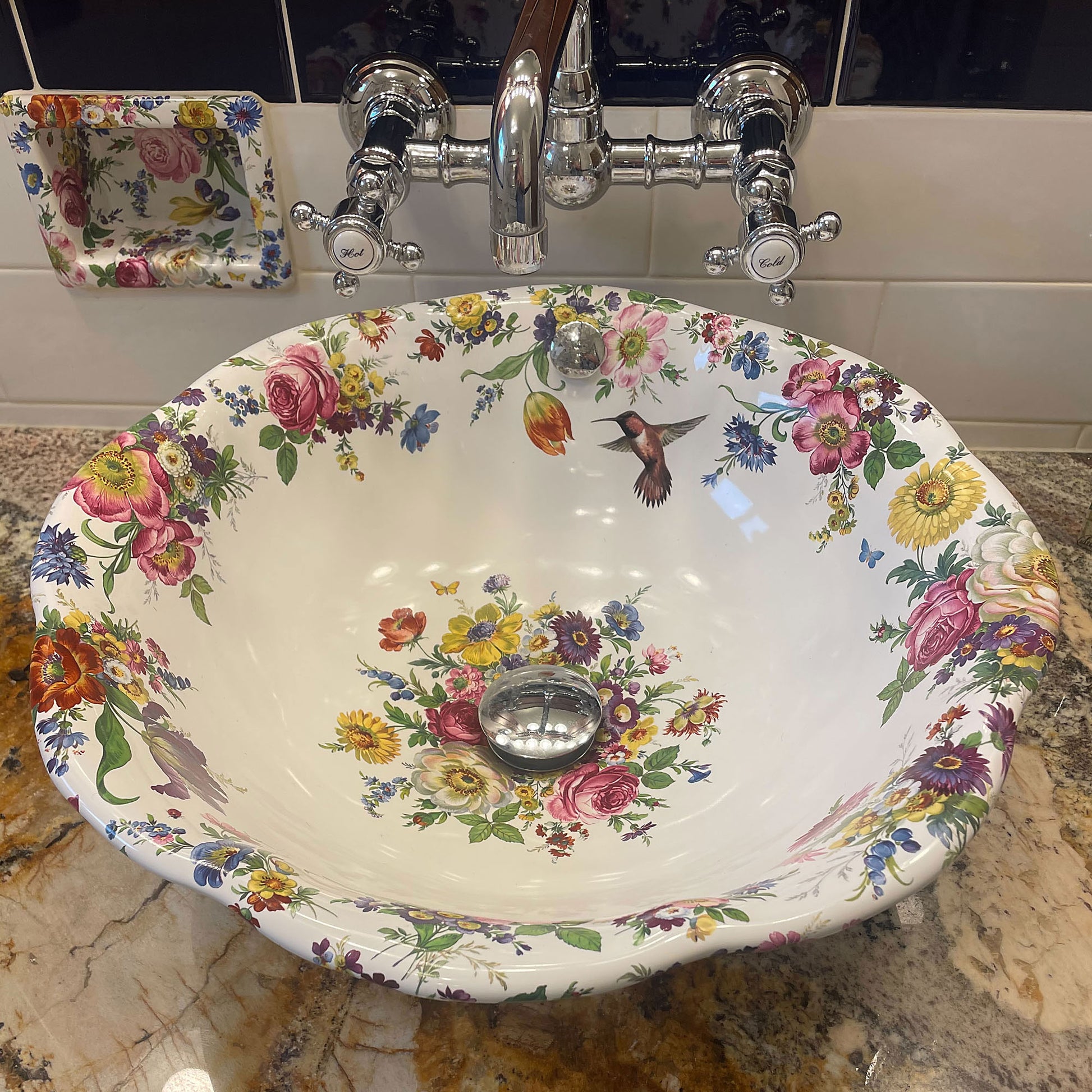 Bathroom featuring Flower vessel sink with hummingbirds