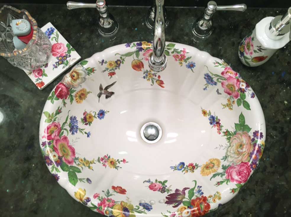 hand painted sink and accessories in bathroom