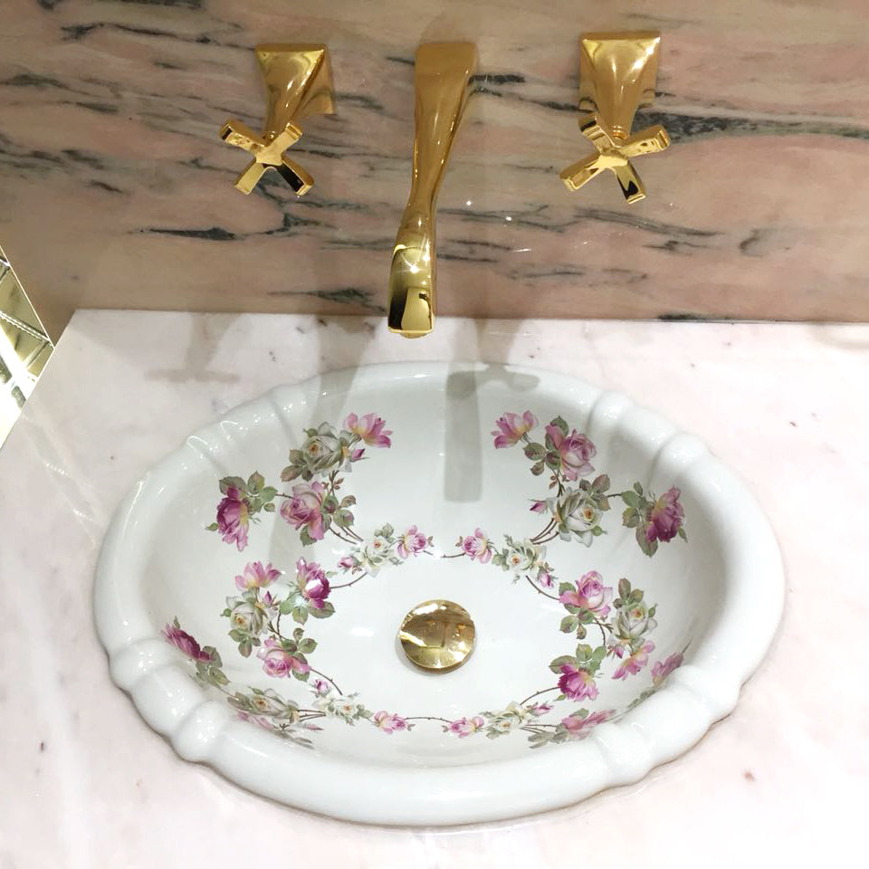 Pink marble bathroom with pink and white roses painted sink
