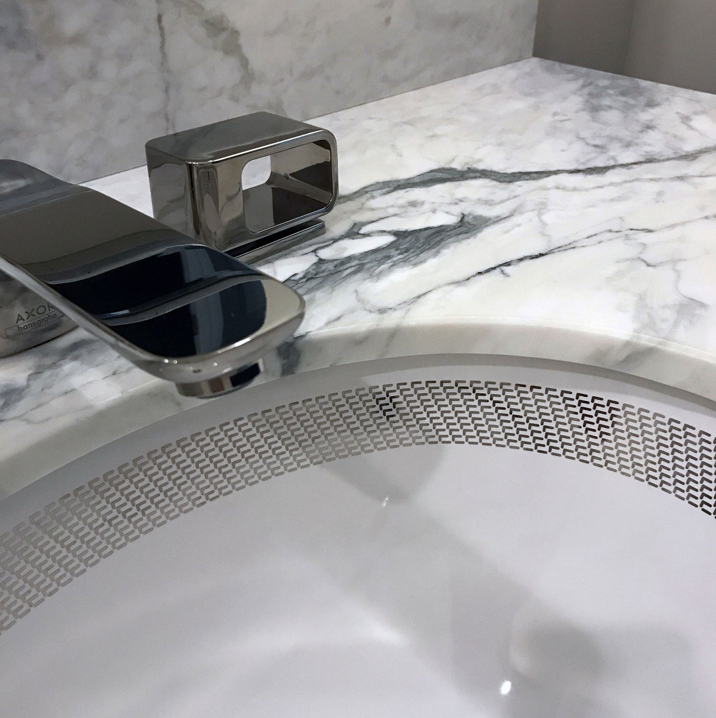 elegant marble counter with silver border painted sink in modern powder room