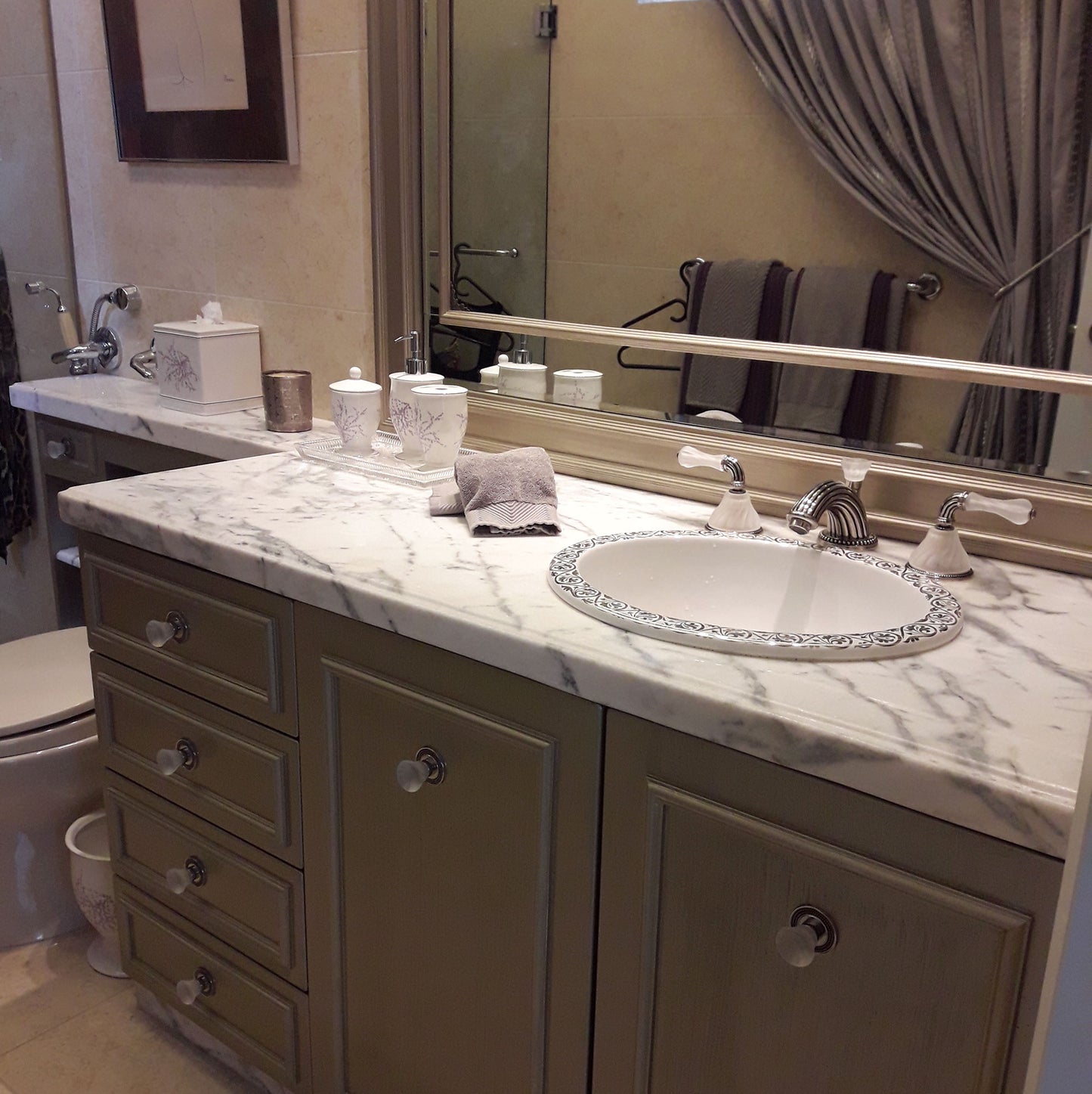 traditional bathroom with silver border design painted on sink