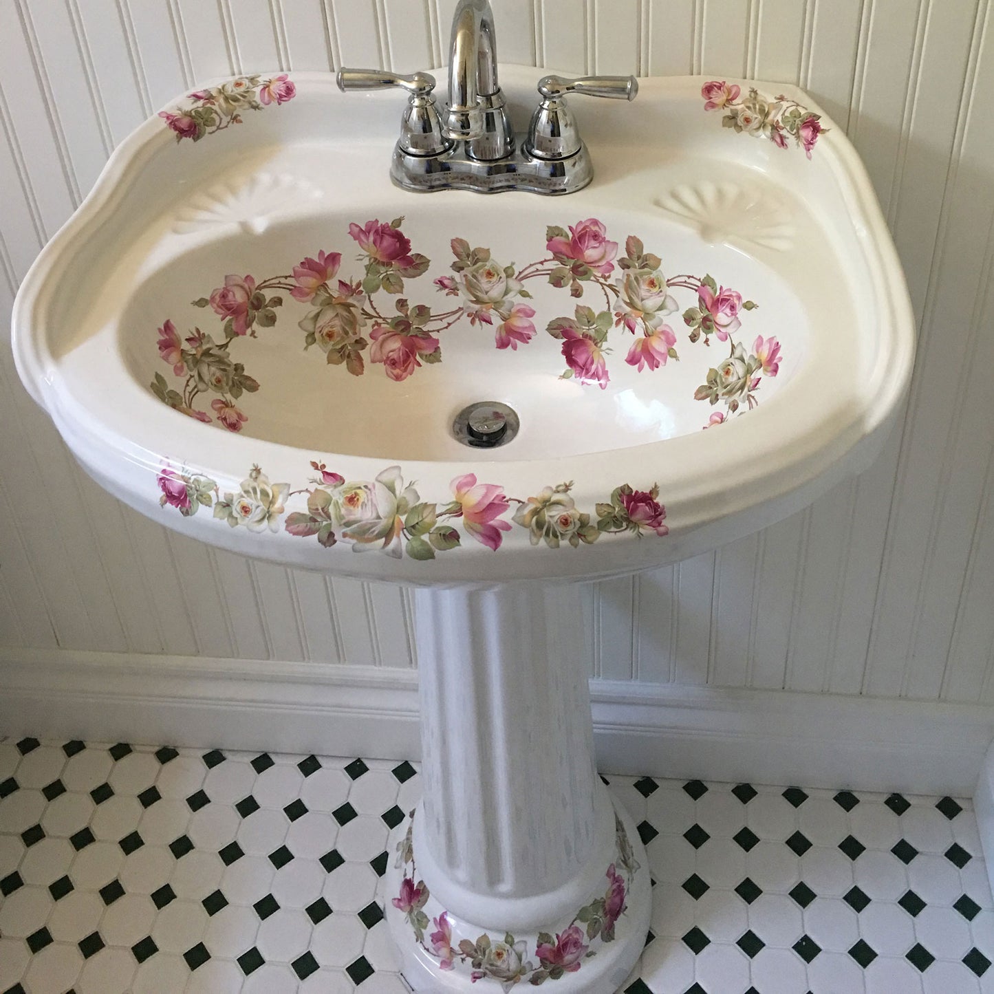 Victorian Bathroom with pink and white roses painted on the pedestal sink